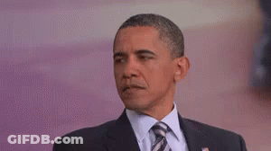Barack Obama Is Wearing A Suit And Tie And Is Making A Funny Face . GIF