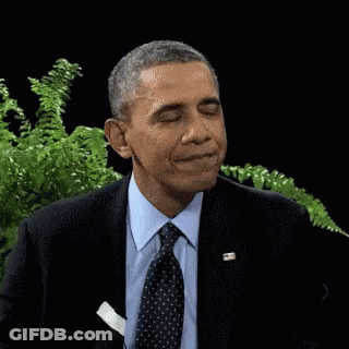 Barack Obama Is Wearing A Suit And Tie With A Pocket Square In His Pocket . GIF