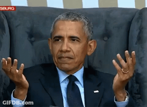 Barack Obama Sitting In A Chair With His Hands Up GIF