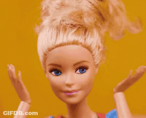 Barbie Doll Close Up With Blue Eyes And Blonde Hair GIF