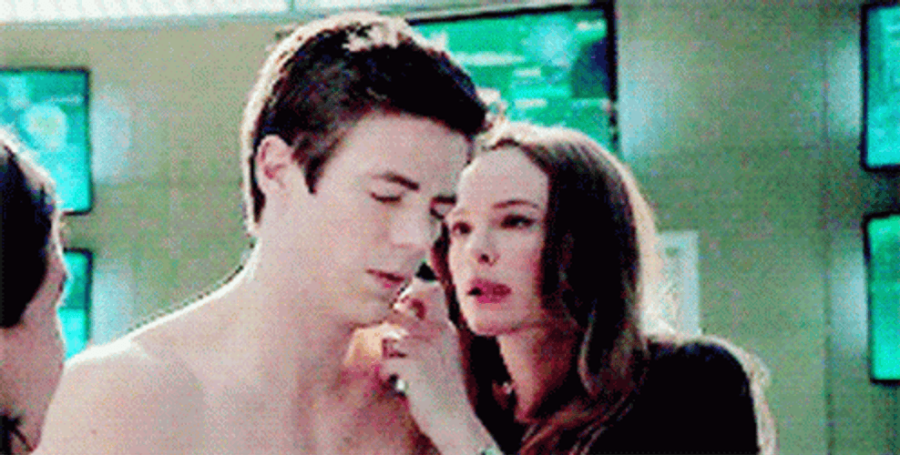 Barry Allen Caitlin Snow Checking Ears GIF