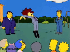 Bart Simpson Is Standing In Front Of A Group Of People While A Man In A Suit Stands Behind Him GIF