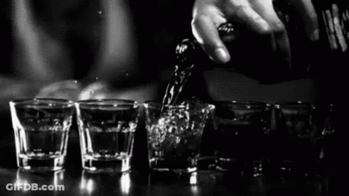 Bartender Pouring Liquor Into Shot Glasses GIF