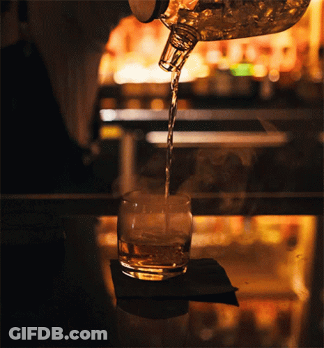 Bartender Pours Glass Of Whiskey GIF