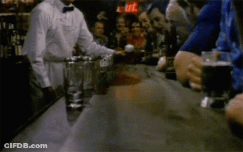 Bartender Serving Drink To Group GIF