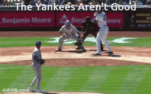 Baseball Game In Front Of Benjamin Moore Banner GIF