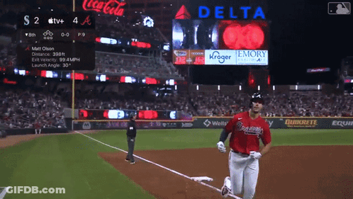 Baseball Game In Front Of Coca Cola And Delta Signs GIF