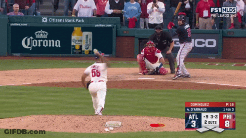 Baseball Game In Front Of Corona Banner GIF