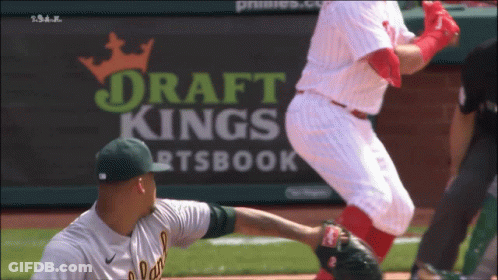 Baseball Game In Front Of DraftKings Banner GIF