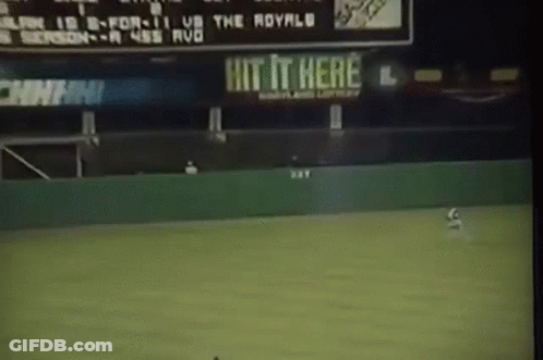 Baseball Game In Front Of Hit It Here Sign GIF