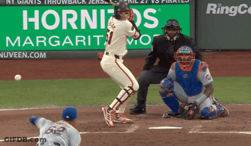 Baseball Game In Front Of Hornitos Sign GIF