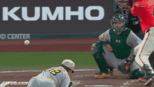Baseball Game In Front Of Kumho Advertisement GIF