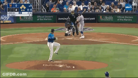 Baseball Game In Front Of Loanche Bank Ad GIF