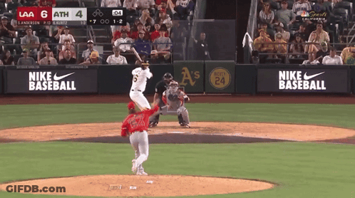 Baseball Game In Front Of Nike Sign GIF