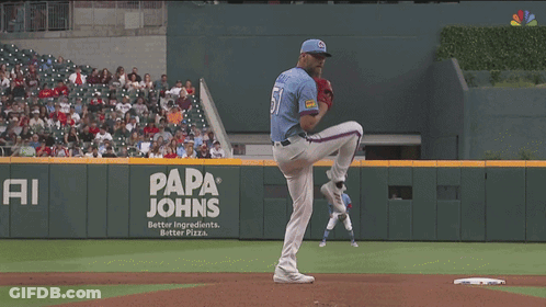 Baseball Game In Front Of Papa Johns Ad GIF