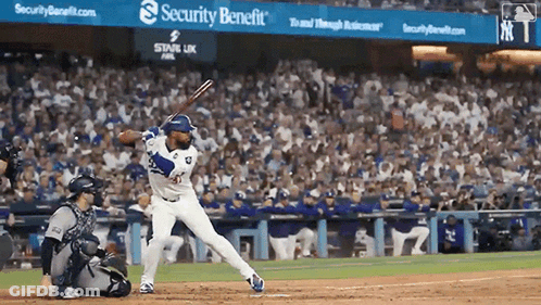 Baseball Game In Front Of Security Benefit Sign GIF