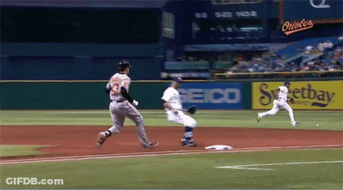 Baseball Game In Front Of Seico Ad GIF