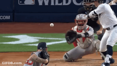 Baseball Game In Front Of Wildcats Banner GIF
