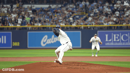 Baseball Pitcher Winding Up In Front Of LBC Sign GIF