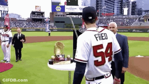 Baseball Player 54 With Trophy On Table GIF