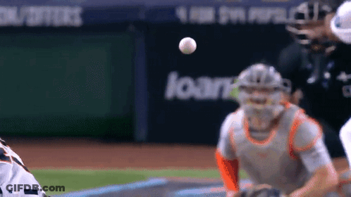 Baseball Player Catching Ball In Front Of Loan Sign GIF