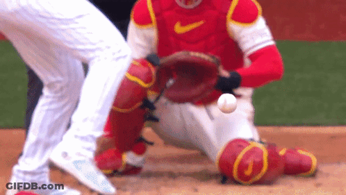 Baseball Player Catching Ball In Red Nike Jersey GIF