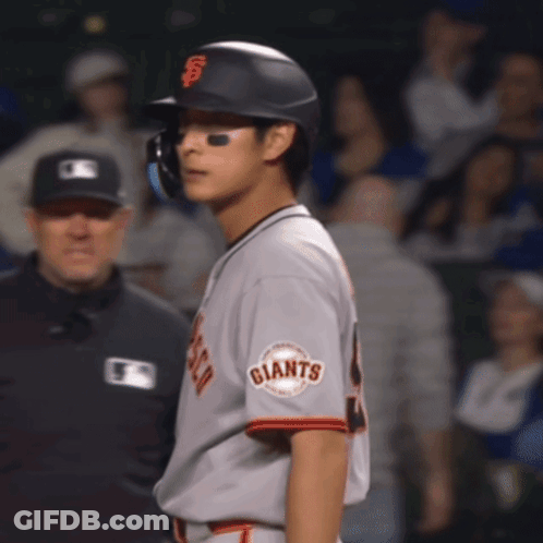 Baseball Player For Giants Standing In Front Of Referee GIF