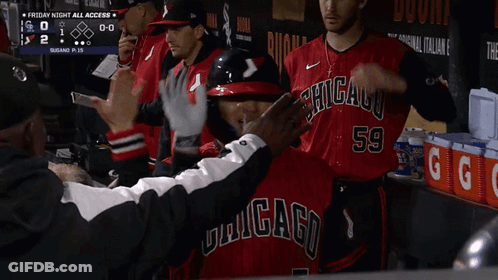 Baseball Player High Fives Teammate GIF