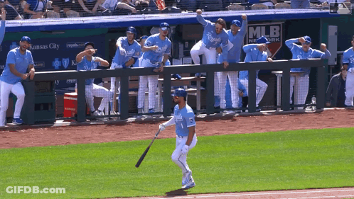 Baseball Player Holding Bat In Front Of MLB Network Dugout GIF