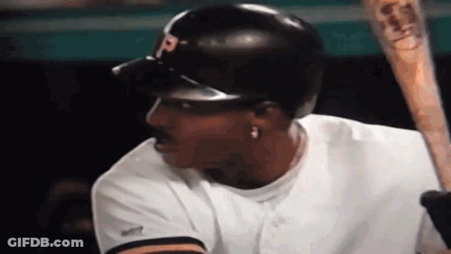 Baseball Player Holding Bat Wearing Helmet GIF