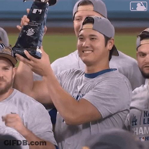 Baseball Player Holding World Series Champions Trophy GIF