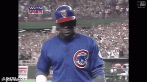 Baseball Player In Blue Cubs Jersey Stands On Field GIF