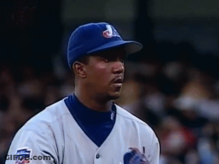 Baseball Player In Blue Hat And White Jersey Number 50 GIF