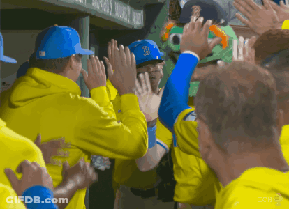 Baseball Player In Blue Hat With B Giving High Five GIF