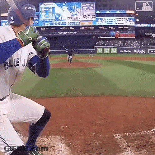 Baseball Player In Blue Jersey About To Swing Bat GIF