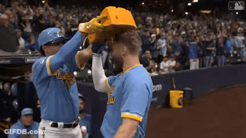 Baseball Player In Blue Jersey And Yellow Hat GIF