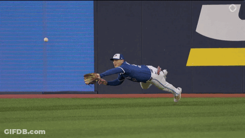 Baseball Player In Blue Jersey Number 12 GIF