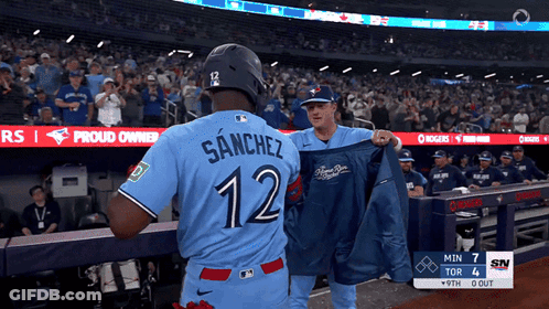 Baseball Player In Blue Jersey Number 12 GIF