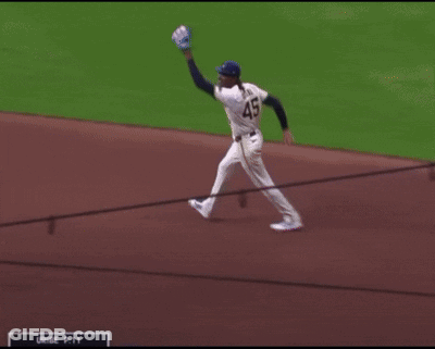 Baseball Player In Blue Jersey Number 45 GIF
