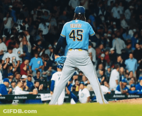 Baseball Player In Blue Jersey Number 45 GIF
