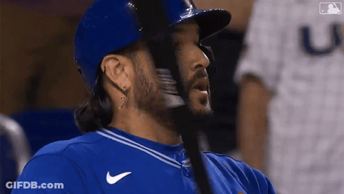 Baseball Player In Blue Jersey With Letter U GIF