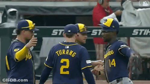 Baseball Player In Blue Uniform Swinging Bat GIF
