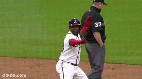 Baseball Player In Braves Jersey Standing On Field GIF