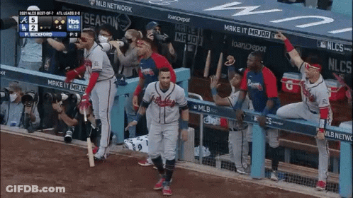 Baseball Player In Braves Uniform Walking On Field GIF