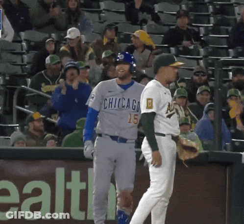 Baseball Player In Chicago Jersey Talking To Another Player GIF