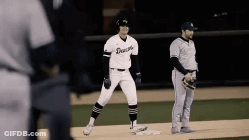 Baseball Player In Denison Jersey On Base GIF