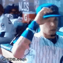 Baseball Player In Dugout With NLCS Sign GIF