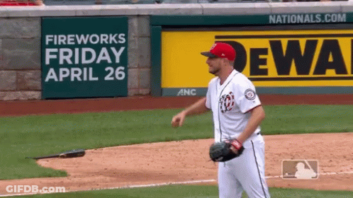 Baseball Player In Front Of Fireworks Sign GIF