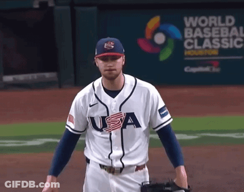 Baseball Player In Front Of World Banner GIF
