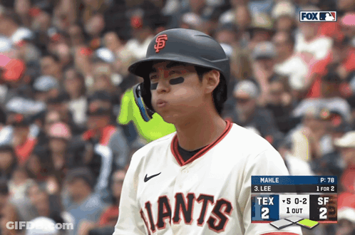 Baseball Player In Giants Jersey Looking At Scoreboard GIF
